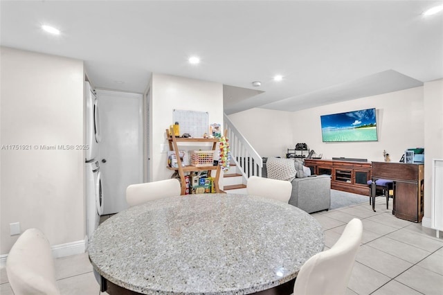 dining area with light tile patterned floors, stairs, baseboards, and recessed lighting