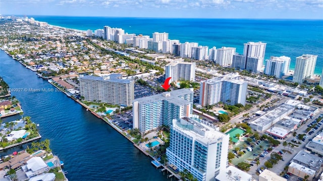 bird's eye view featuring a water view and a city view