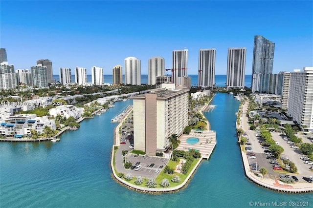 birds eye view of property featuring a view of city and a water view