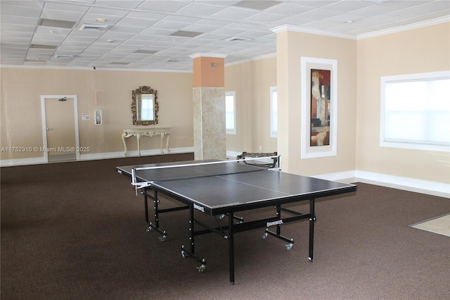 recreation room featuring plenty of natural light, visible vents, baseboards, and crown molding