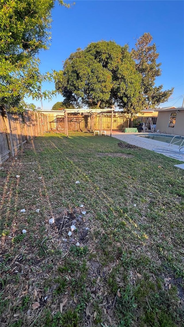 view of yard featuring a patio area and a fenced backyard