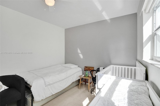 bedroom featuring light tile patterned floors