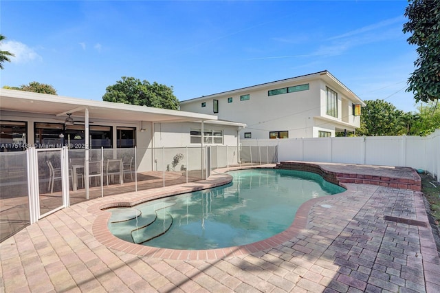 view of pool featuring fence, a fenced in pool, and a patio