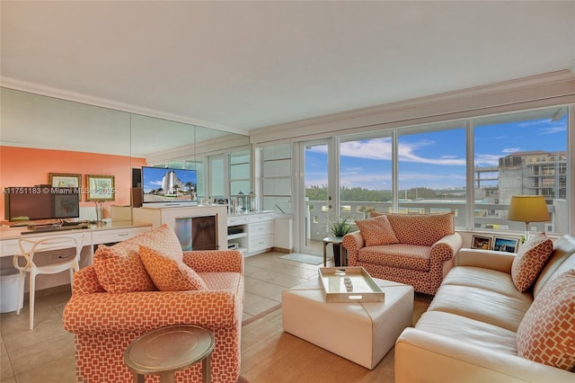 living room featuring ornamental molding and light tile patterned flooring