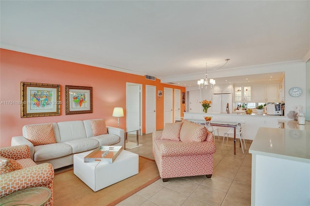 living area with ornamental molding, visible vents, a notable chandelier, and light tile patterned floors