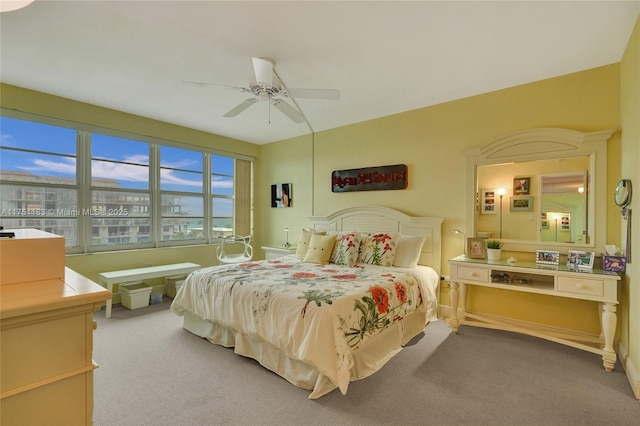 carpeted bedroom featuring a ceiling fan