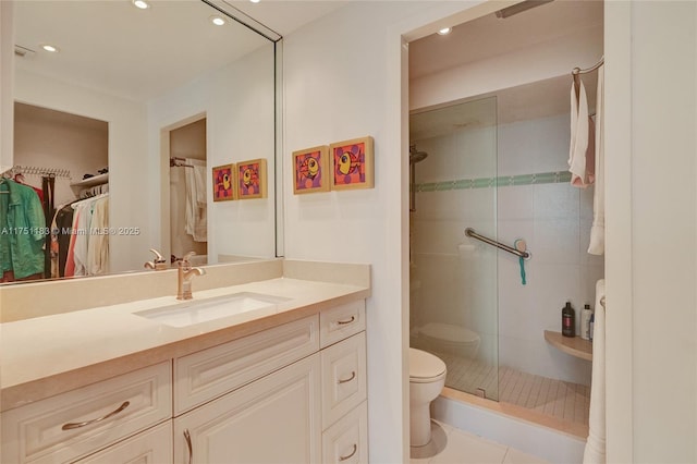 full bathroom with a stall shower, vanity, toilet, and recessed lighting