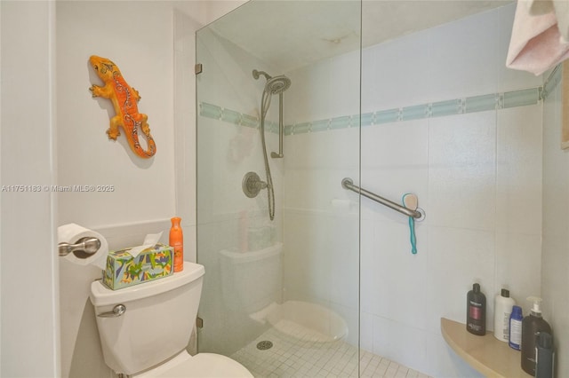 full bath with a shower stall and toilet