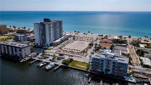 bird's eye view featuring a water view and a city view