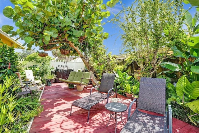 view of patio featuring a fenced backyard and a wooden deck