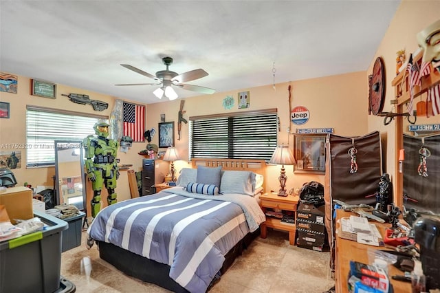 bedroom with a ceiling fan and light tile patterned floors