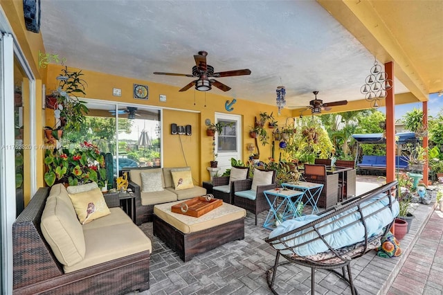 view of patio / terrace with an outdoor living space and a ceiling fan