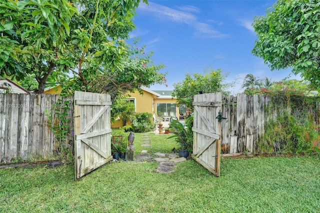 view of yard featuring a gate and fence