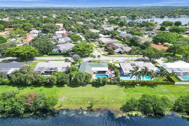 birds eye view of property with a water view and a residential view