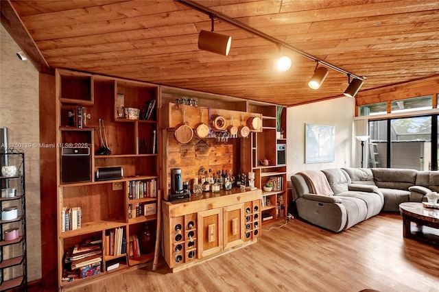 living room with rail lighting, wood ceiling, and wood finished floors