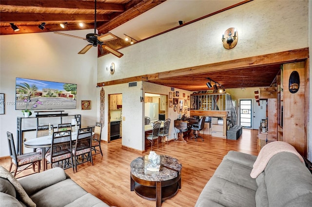 living room with wooden ceiling, visible vents, beamed ceiling, and wood finished floors