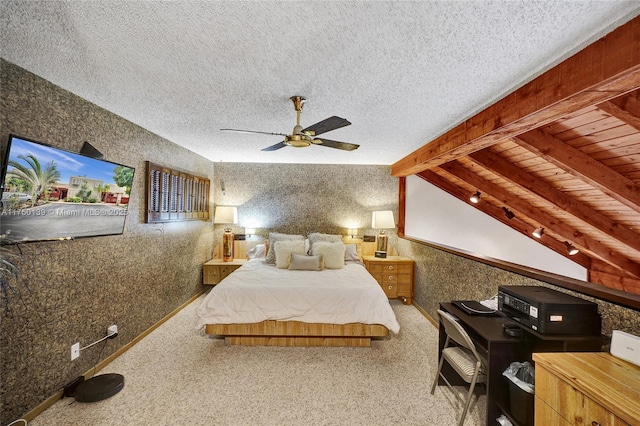 bedroom featuring lofted ceiling with beams, wallpapered walls, baseboards, and a textured ceiling