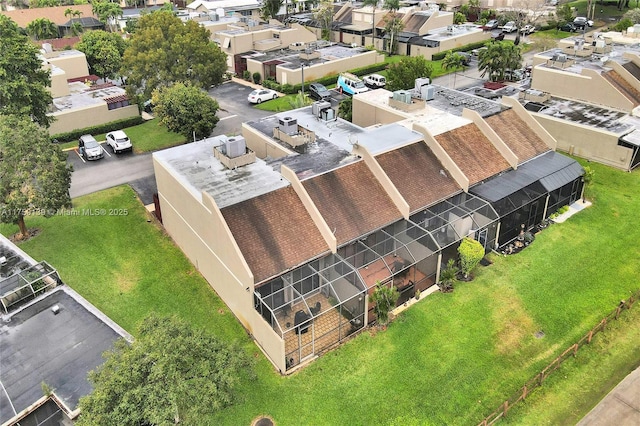 birds eye view of property with a residential view