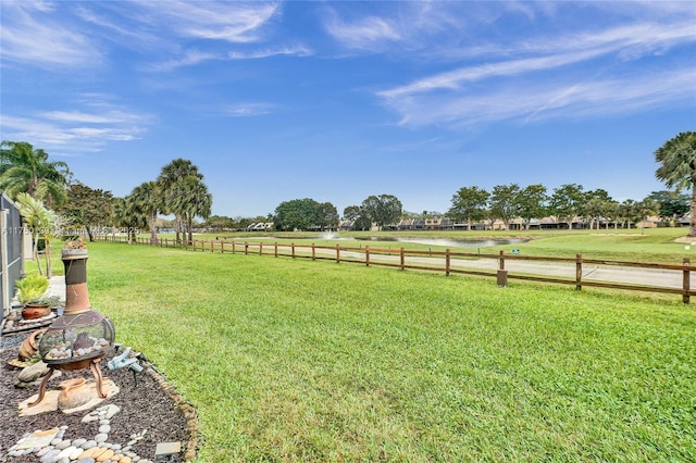 view of yard featuring a rural view and fence