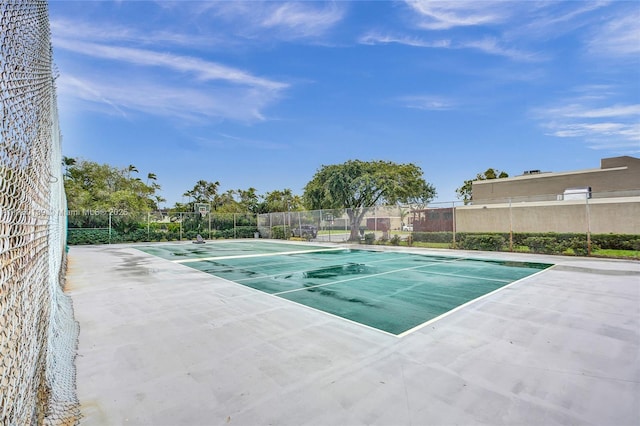 view of swimming pool featuring fence