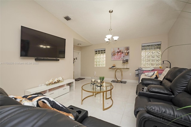 living room featuring light tile patterned floors, visible vents, baseboards, vaulted ceiling, and an inviting chandelier