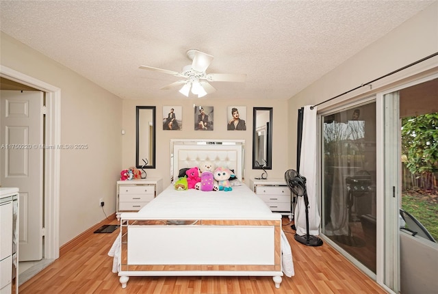 bedroom featuring ceiling fan, access to outside, light wood-style flooring, and a textured ceiling