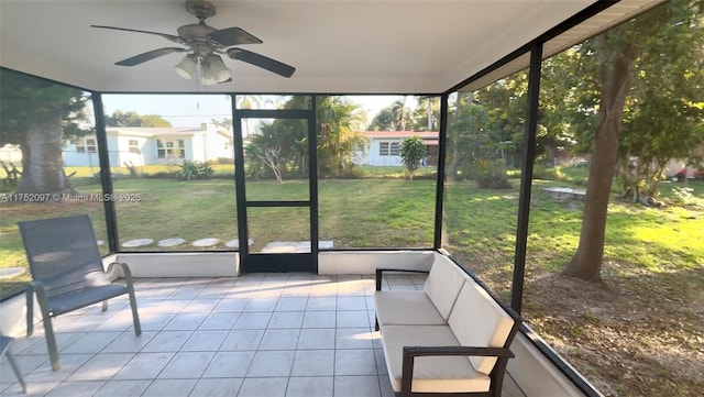 unfurnished sunroom with a ceiling fan