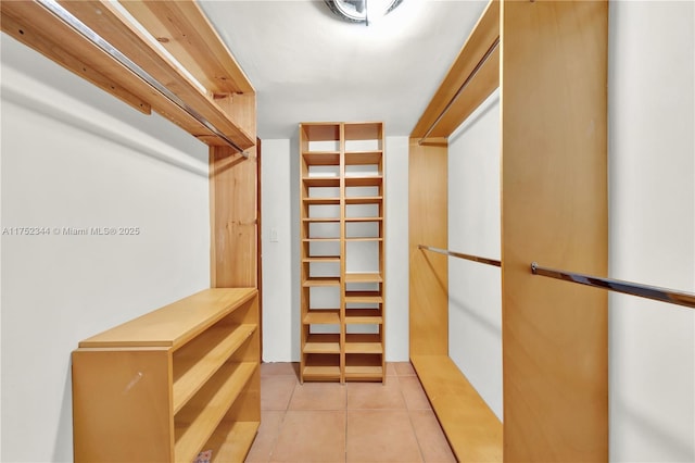 walk in closet featuring light tile patterned floors