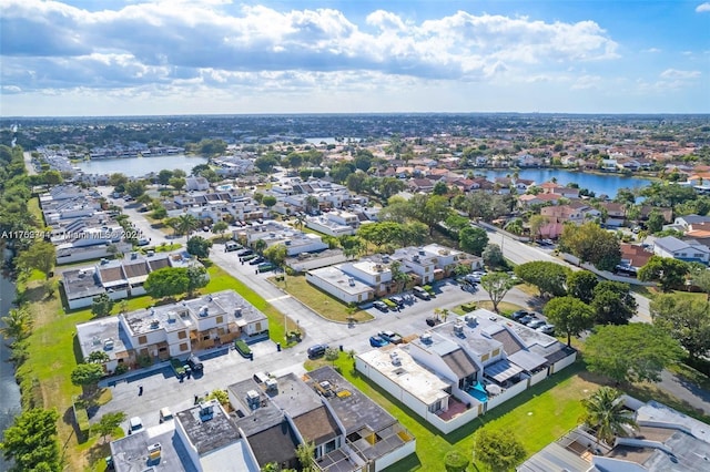 bird's eye view with a residential view and a water view