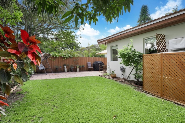 view of yard with a patio and fence