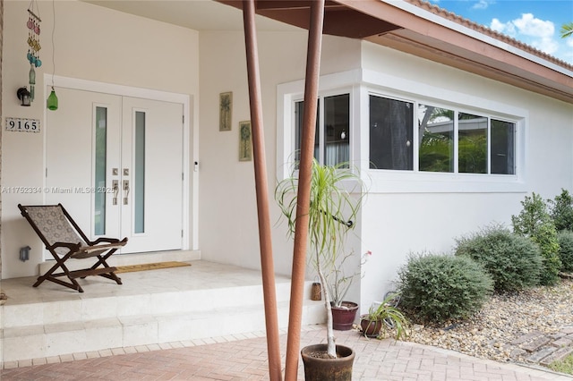 doorway to property with stucco siding