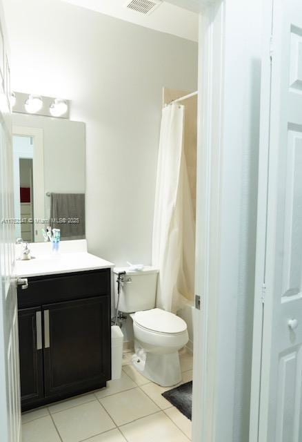 full bath with toilet, vanity, visible vents, and tile patterned floors