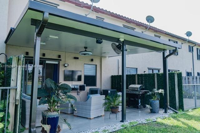 view of patio / terrace with fence, grilling area, and ceiling fan