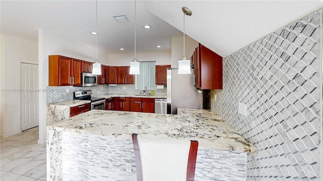 kitchen featuring marble finish floor, stainless steel appliances, tasteful backsplash, hanging light fixtures, and a peninsula