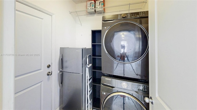 laundry area featuring laundry area and stacked washer / dryer