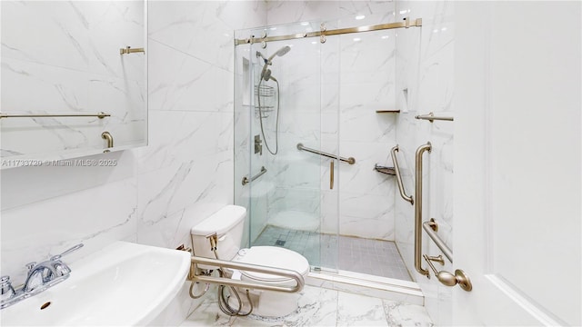 full bathroom featuring a sink, toilet, and a marble finish shower