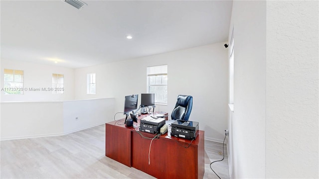 office area with baseboards, recessed lighting, visible vents, and light wood-style floors