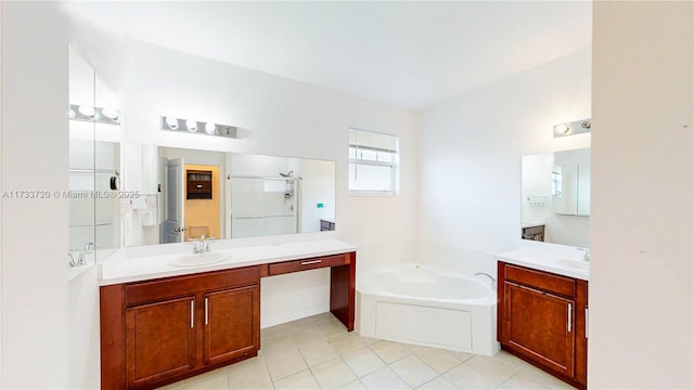 bathroom featuring a garden tub, two vanities, a sink, and a shower stall