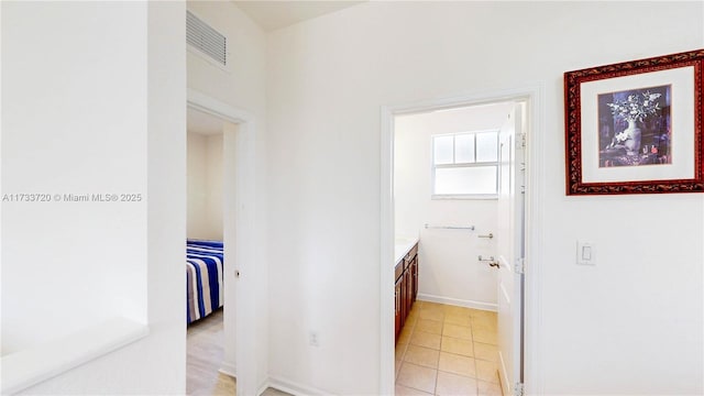 bathroom with visible vents, tile patterned flooring, vanity, and baseboards