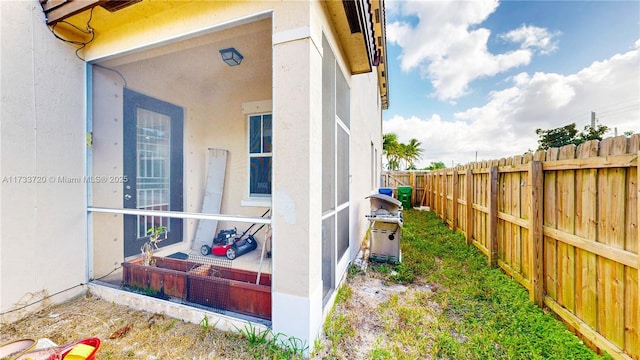 view of property exterior with a fenced backyard and stucco siding