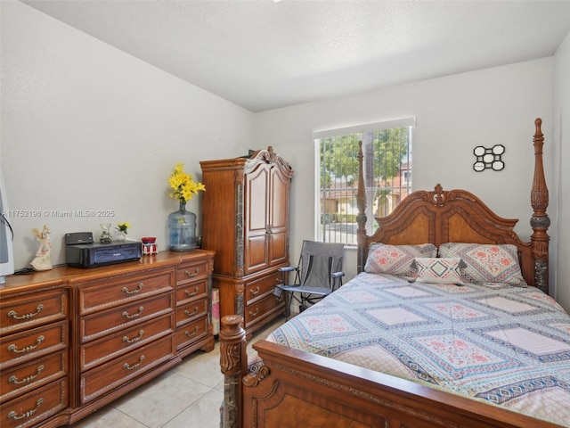 bedroom with light tile patterned floors