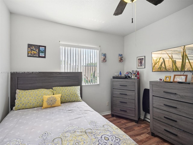 bedroom with ceiling fan, dark wood finished floors, and baseboards