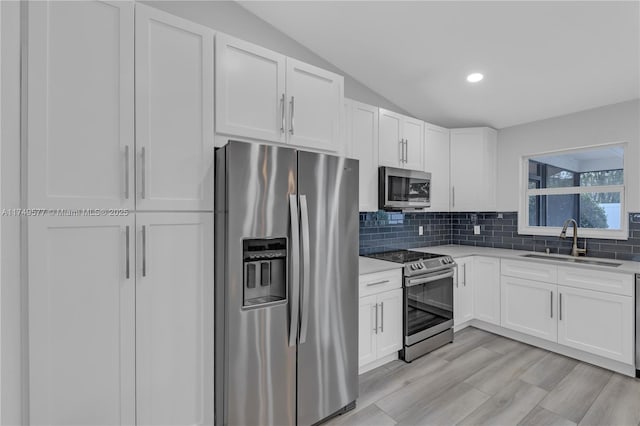 kitchen featuring appliances with stainless steel finishes and white cabinets