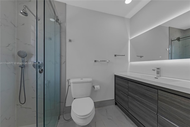 bathroom with a marble finish shower, baseboards, toilet, marble finish floor, and vanity