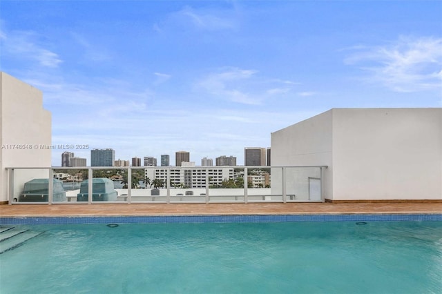 pool with a water view and a view of city