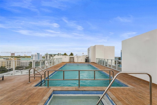 view of swimming pool with a view of city