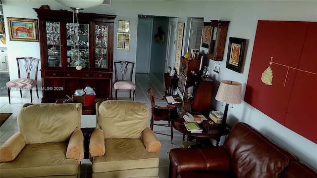 sitting room with visible vents and tile patterned floors