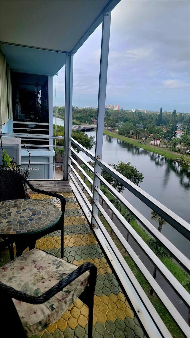 balcony featuring a water view