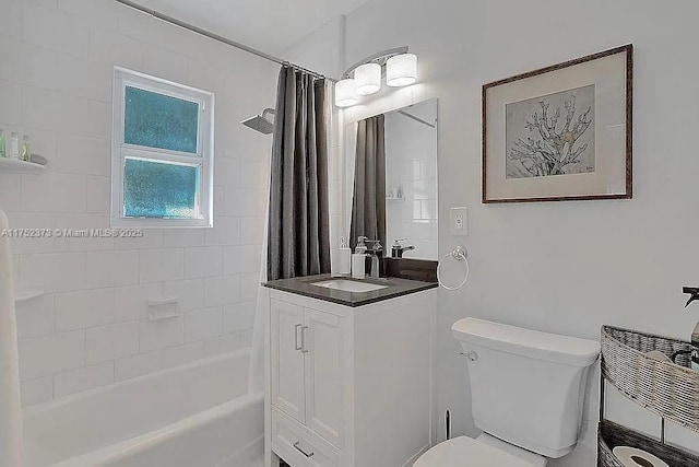 bathroom featuring vanity, shower / bath combination with curtain, and toilet
