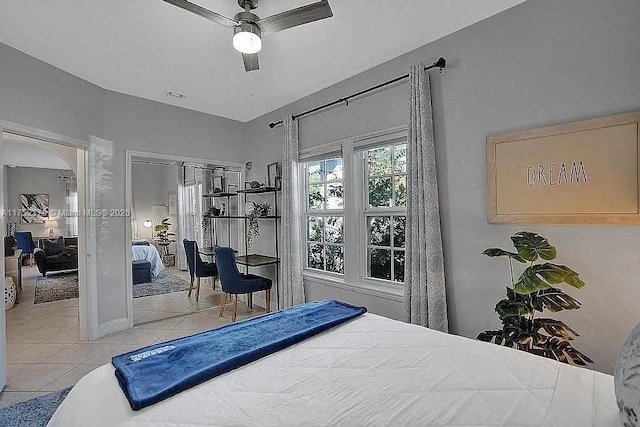 bedroom with light tile patterned flooring and a ceiling fan